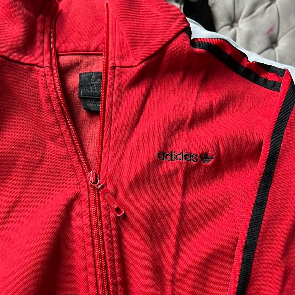 Adidas’s original zip up rapper track shirt